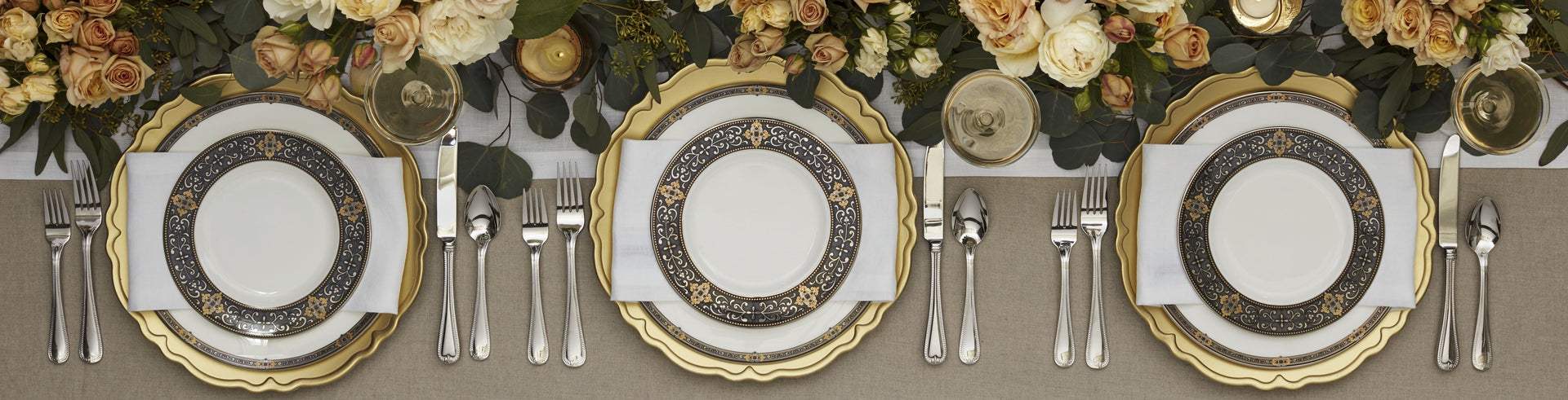 Elegant table setting with gold and ornate plates
