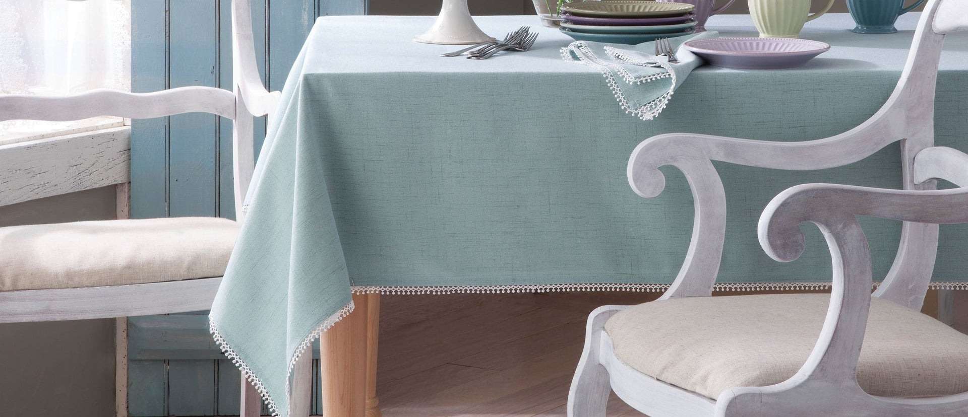 Light blue tablecloth with white lace trim