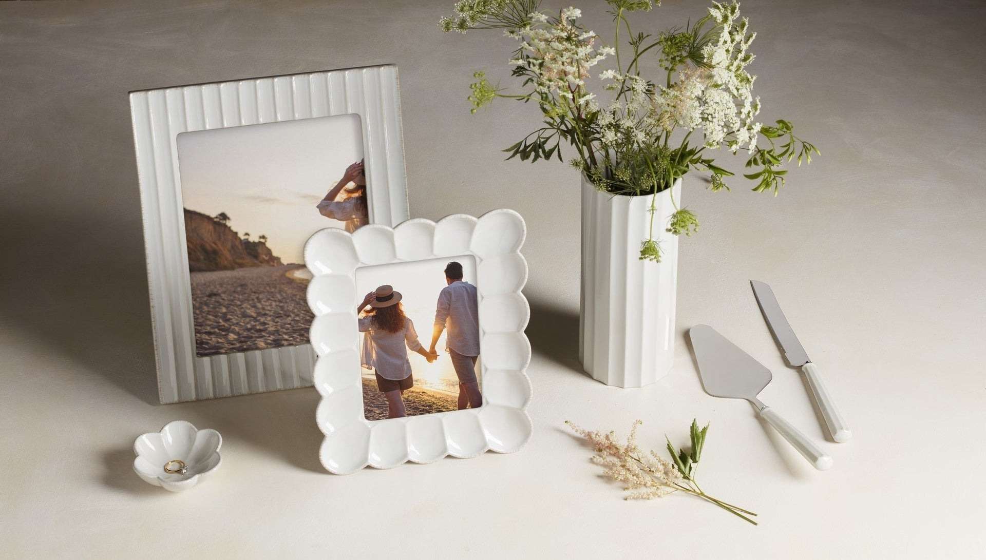 White ceramic frames and floral vase