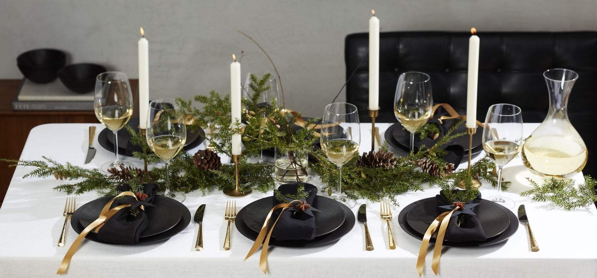  Gemini said Elegant holiday table setting with black plates.