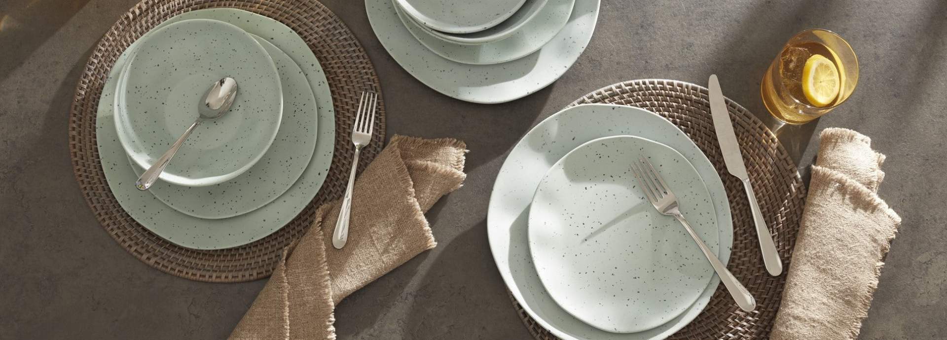 Speckled mint dinnerware on woven placemats