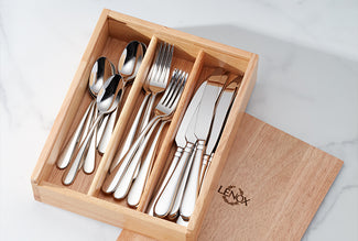 Silver cutlery set in a wooden organizer with 'Lenox' branding on a white background