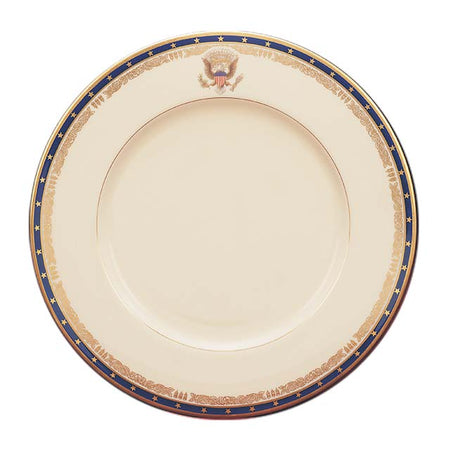 Cream porcelain plate featuring a gold Presidential Seal and a navy blue border with gold stars.