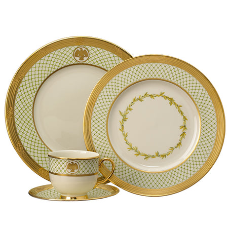 Cream dinnerware set with green lattice borders, gold eagle emblems, and gold rims.